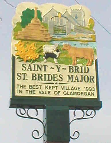 Village Sign St Brides Major/Saint-y-Brid depicting church & preaching cross and commemorating Best Kept Village award in 1993