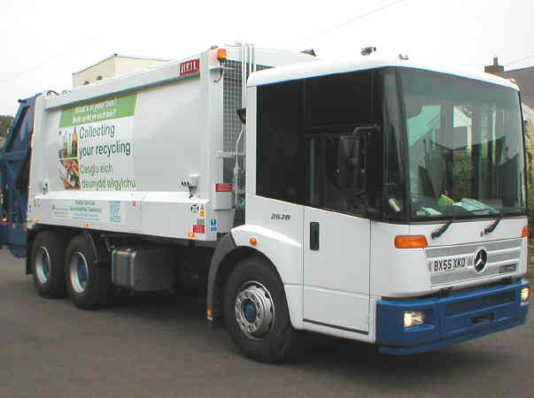 Council vehicle kerbside recycling collection of plastic and card