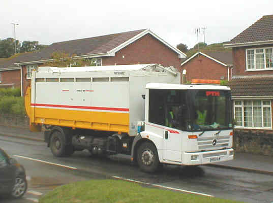 Council vehicle kerbside recyling collection of paper, cans and glass